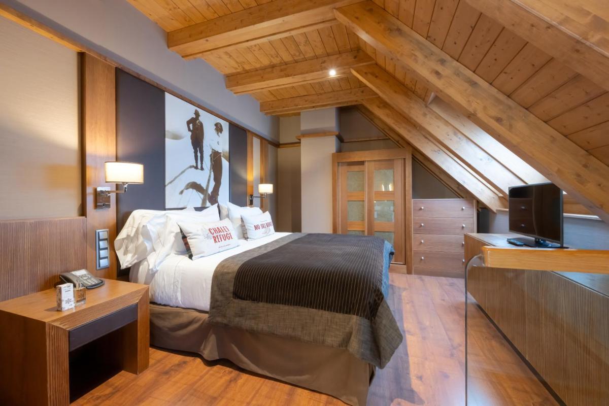 Cama o camas de una habitación en Hotel Val de Neu G.L.