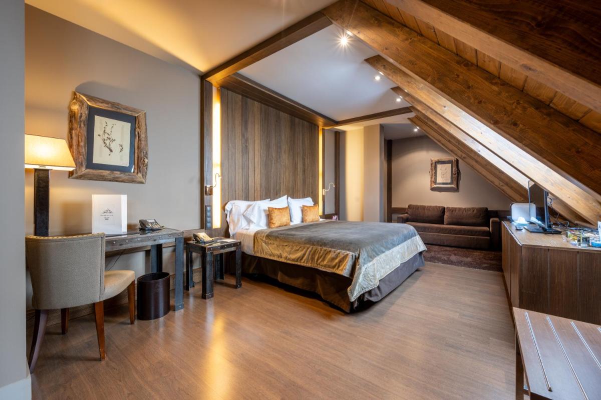 Cama o camas de una habitación en Hotel Val de Neu G.L.