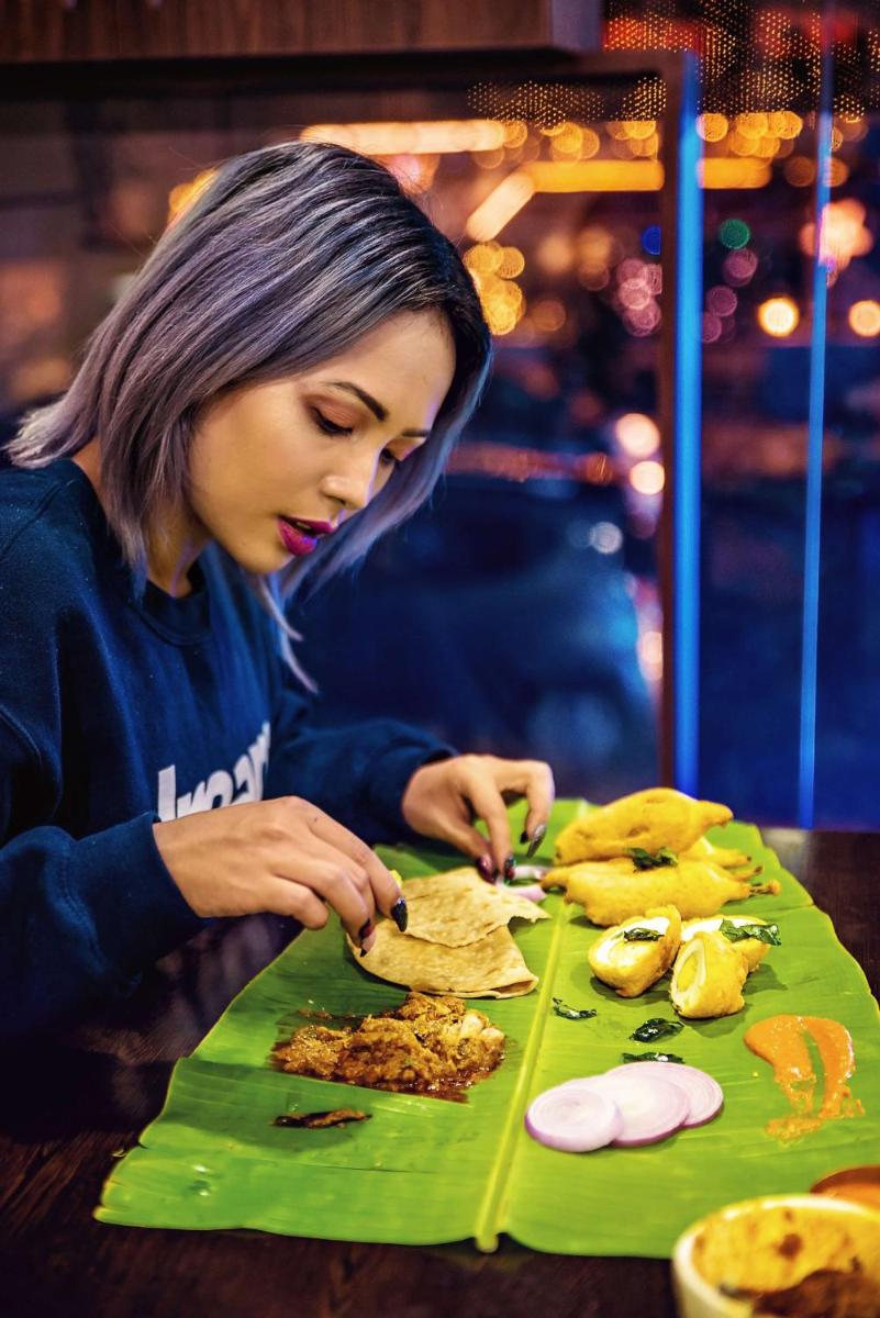 a woman is preparing food on a table at Hyatt Centric MG Road Bangalore in Bengaluru a woman is preparing food on a table at Hyatt Centric MG Road Bangalore in Bengaluru