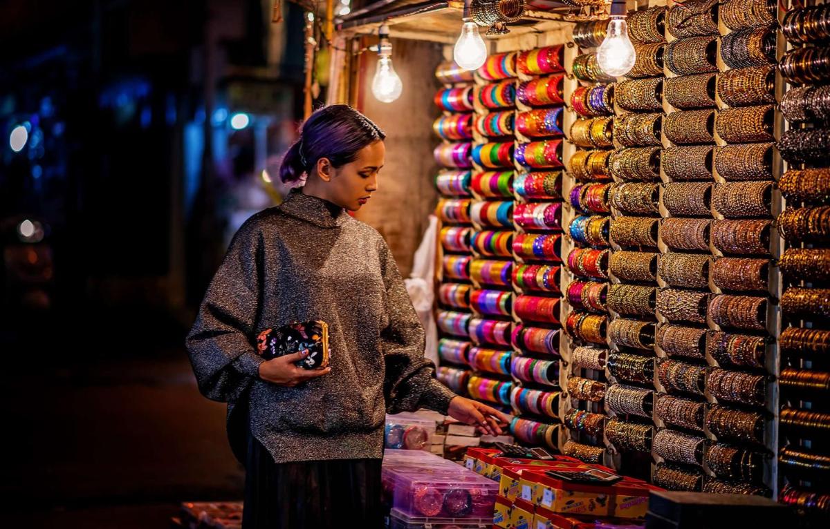 a woman standing next to a pile of hats at Hyatt Centric MG Road Bangalore in Bengaluru a woman standing next to a pile of hats at Hyatt Centric MG Road Bangalore in Bengaluru