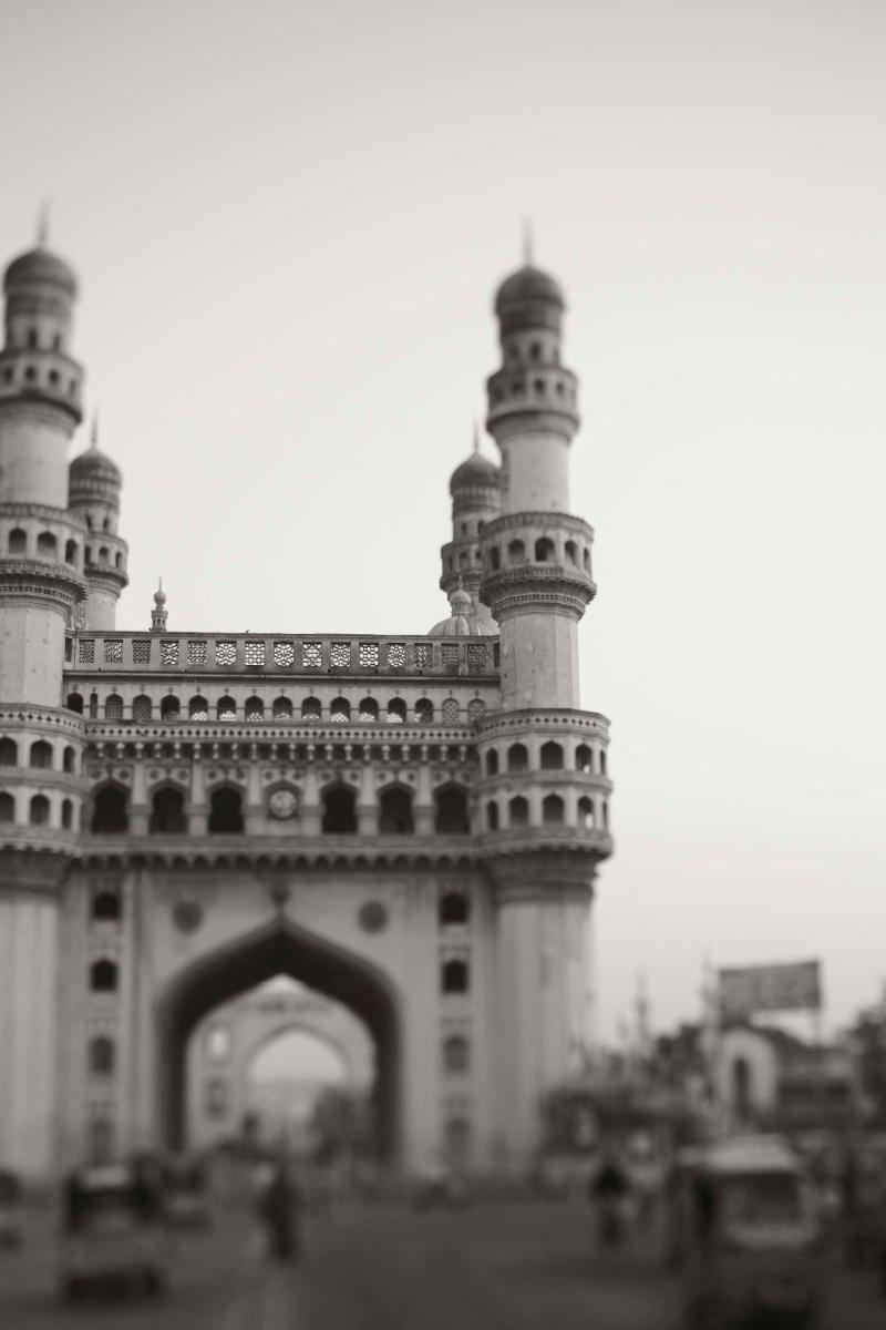 a black and white photo of a building with a tower at Park Hyatt Hotel and Residences, Hyderabad in Hyderabad