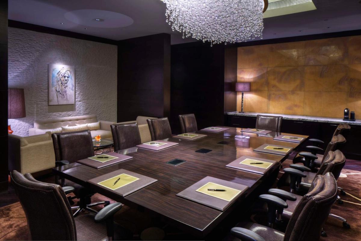 a conference room with a long table and chairs at Park Hyatt Hotel and Residences, Hyderabad in Hyderabad