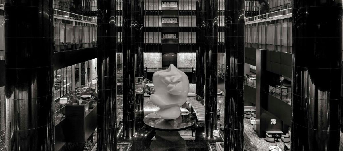 a large white statue in the middle of a building at Park Hyatt Hotel and Residences, Hyderabad in Hyderabad