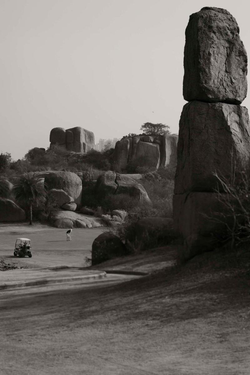 a black and white photo of a field with rocks at Park Hyatt Hotel and Residences, Hyderabad in Hyderabad
