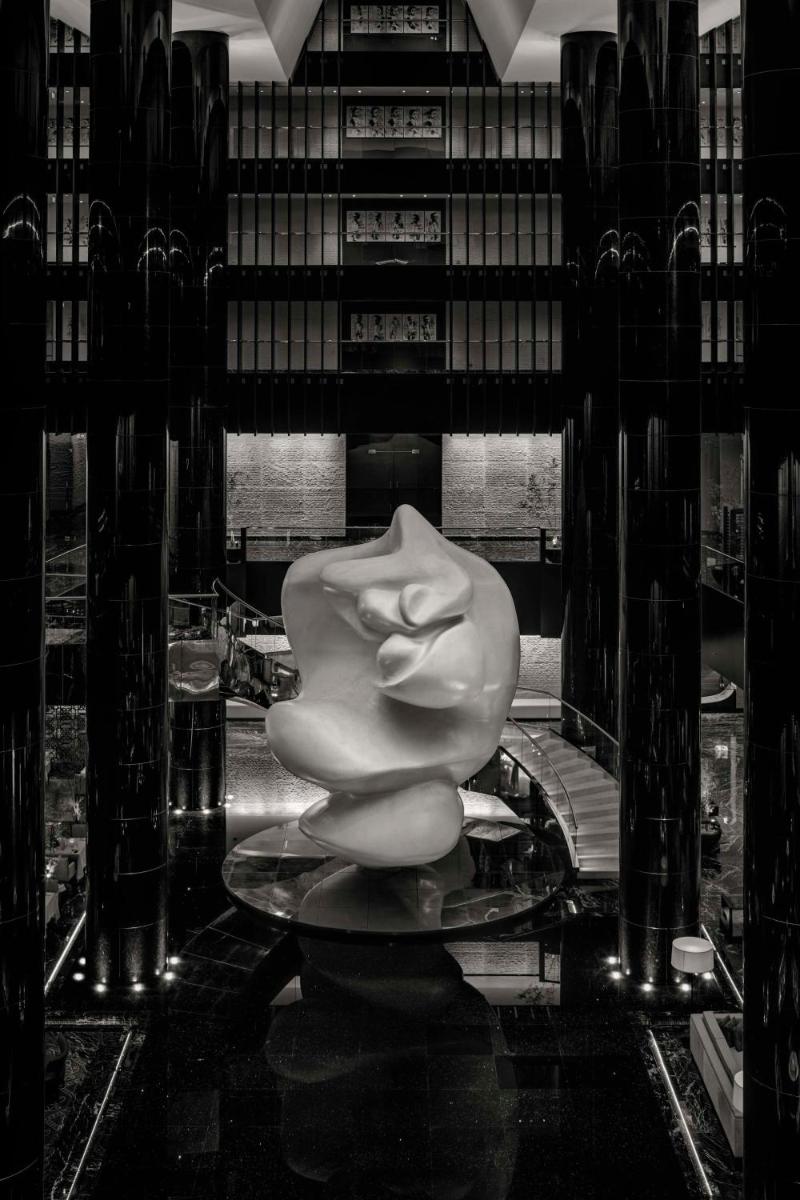 a white sculpture sitting on a table in a room at Park Hyatt Hotel and Residences, Hyderabad in Hyderabad