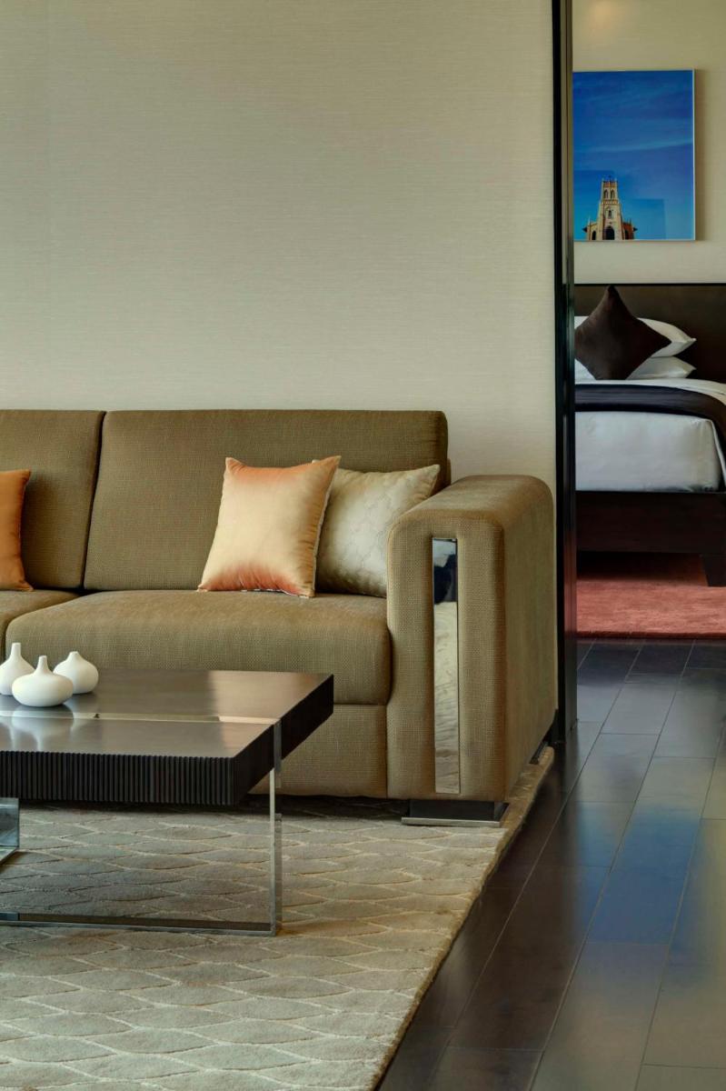 a living room with a couch and a coffee table at Park Hyatt Hotel and Residences, Hyderabad in Hyderabad