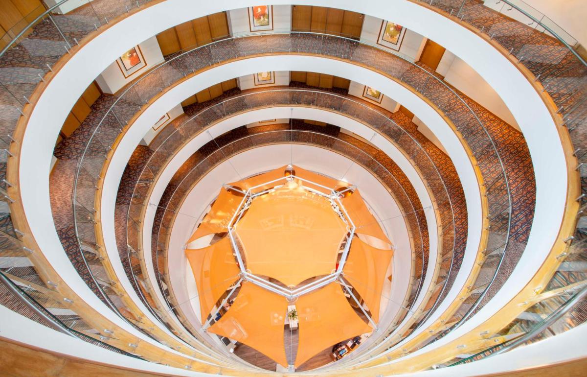 an overhead view of a spiral staircase in a building at Hyatt Place Hyderabad Banjara Hills in Hyderabad