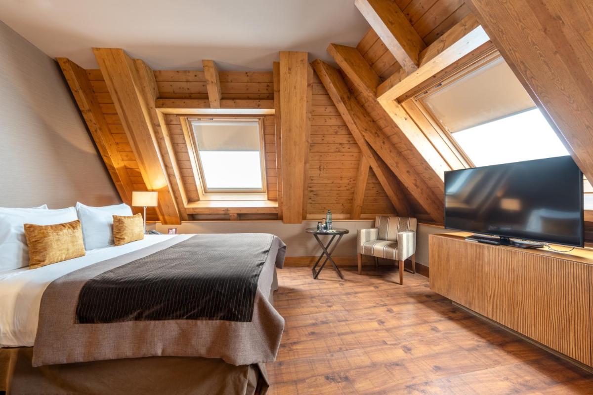 Cama o camas de una habitación en Hotel Val de Neu G.L.