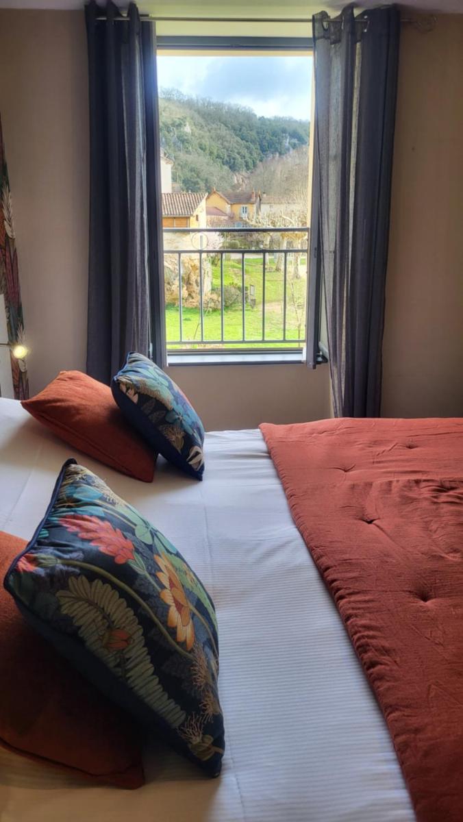 Un ou plusieurs lits dans un hébergement de l'établissement Hôtel Spa La Truite Dorée
