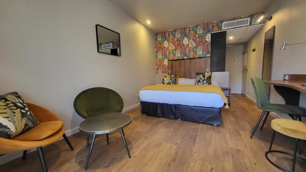 Un ou plusieurs lits dans un hébergement de l'établissement Hôtel Spa La Truite Dorée