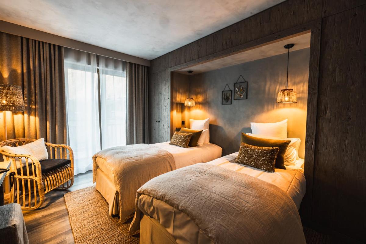 Un ou plusieurs lits dans un hébergement de l'établissement Hôtel de la Roche