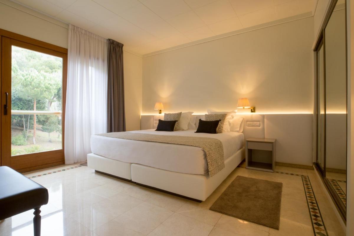 Cama o camas de una habitación en Hotel Santa Marta