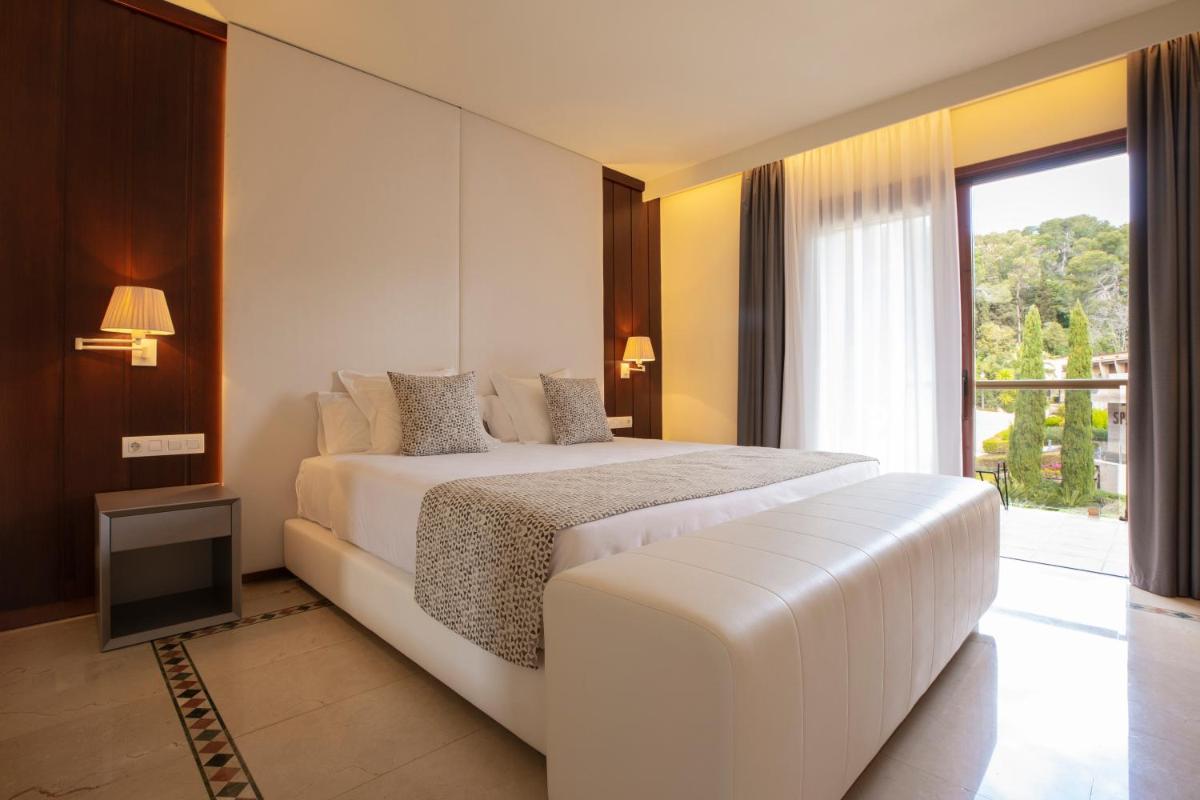 Cama o camas de una habitación en Hotel Santa Marta