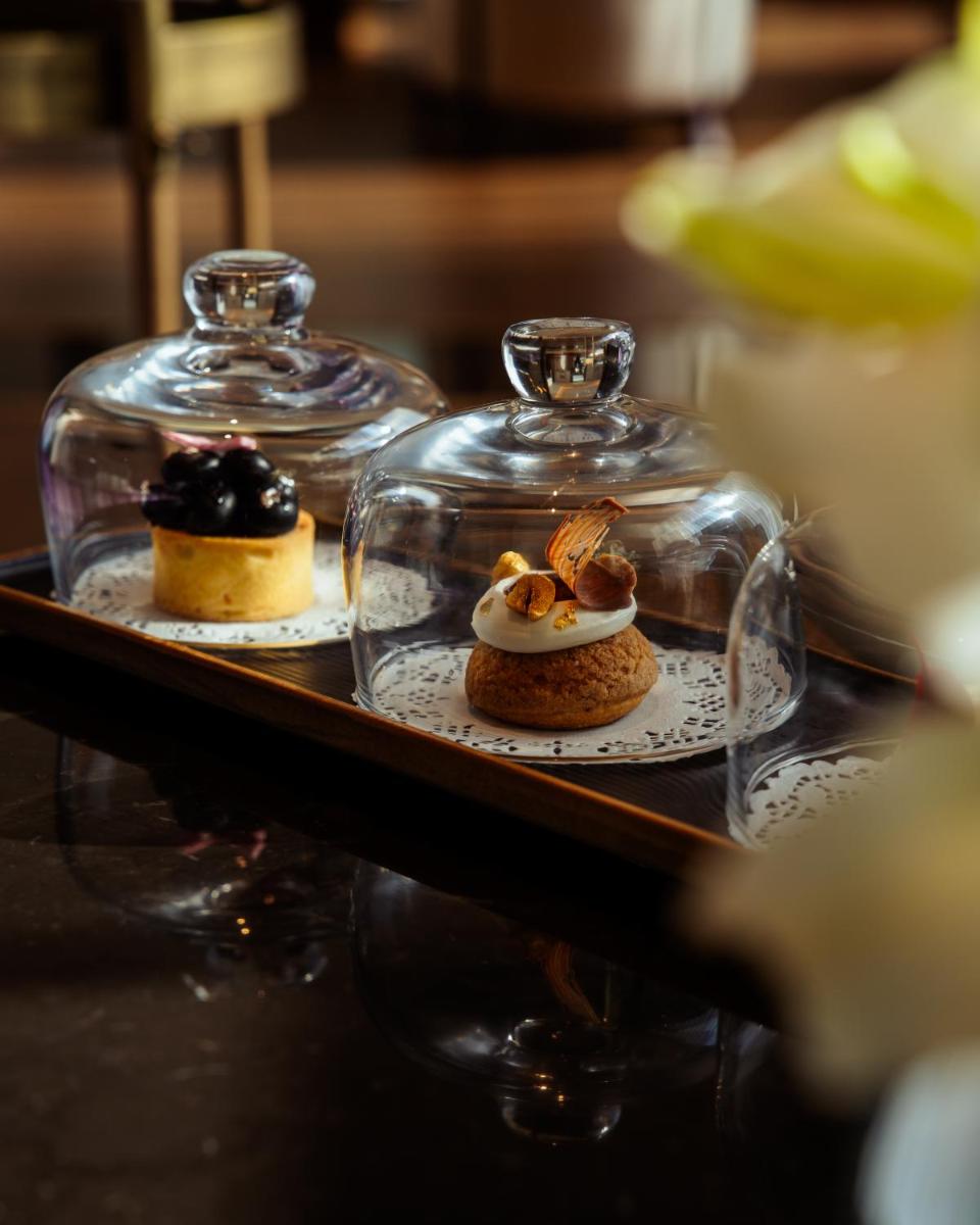 two desserts in glass jars on a table at JW Marriott Hotel Kolkata in Kolkata