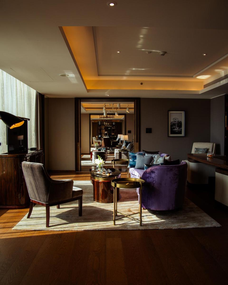 a living room with a couch and a table at JW Marriott Hotel Kolkata in Kolkata