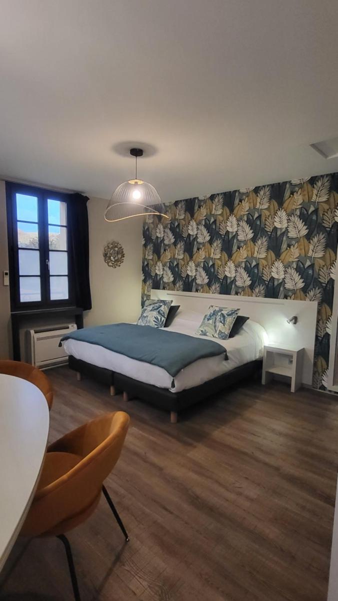 Un ou plusieurs lits dans un hébergement de l'établissement Hôtel Spa La Truite Dorée