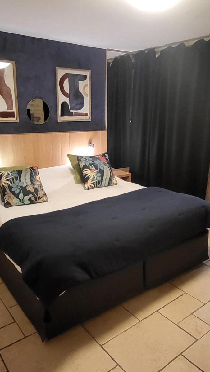 Un ou plusieurs lits dans un hébergement de l'établissement Hôtel Spa La Truite Dorée