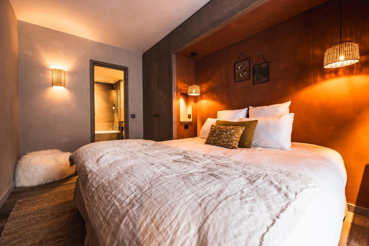 Un ou plusieurs lits dans un hébergement de l'établissement Hôtel de la Roche