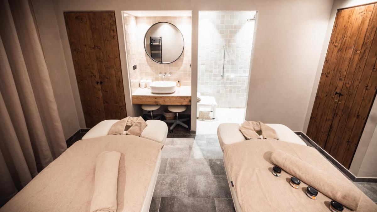 Un ou plusieurs lits dans un hébergement de l'établissement Hôtel de la Roche