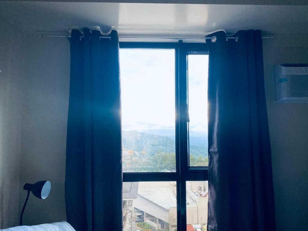 Casa de Guapo - AYALA Serin East Taal View Condo - Housity