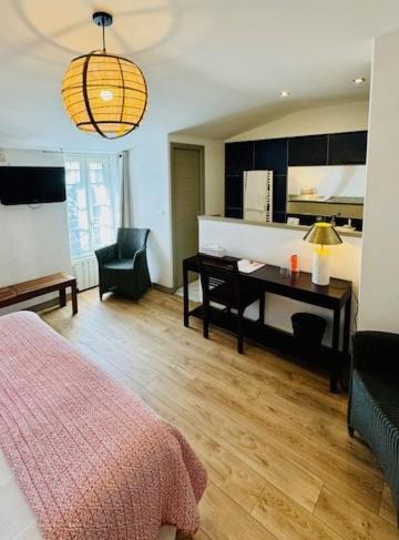 Un ou plusieurs lits dans un hébergement de l'établissement Hotel L'Océan