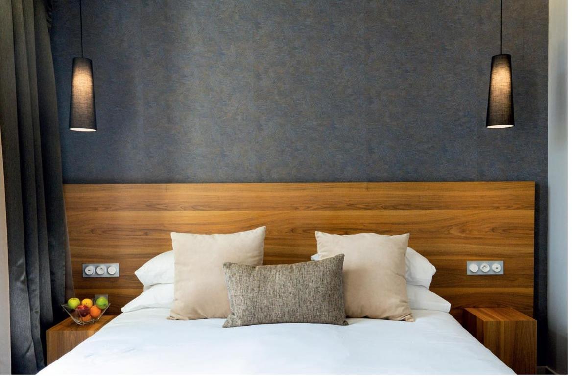 Un ou plusieurs lits dans un hébergement de l'établissement Fac & Spera -Hôtel & Spa