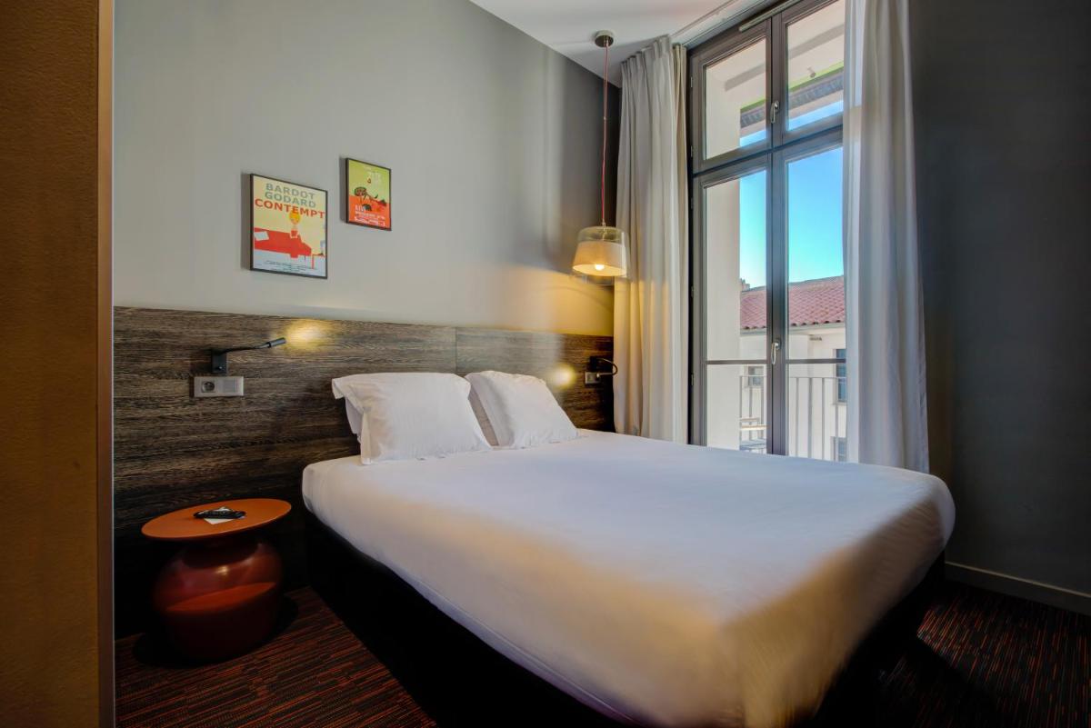 Un ou plusieurs lits dans un hébergement de l'établissement Alex Hotel & Spa