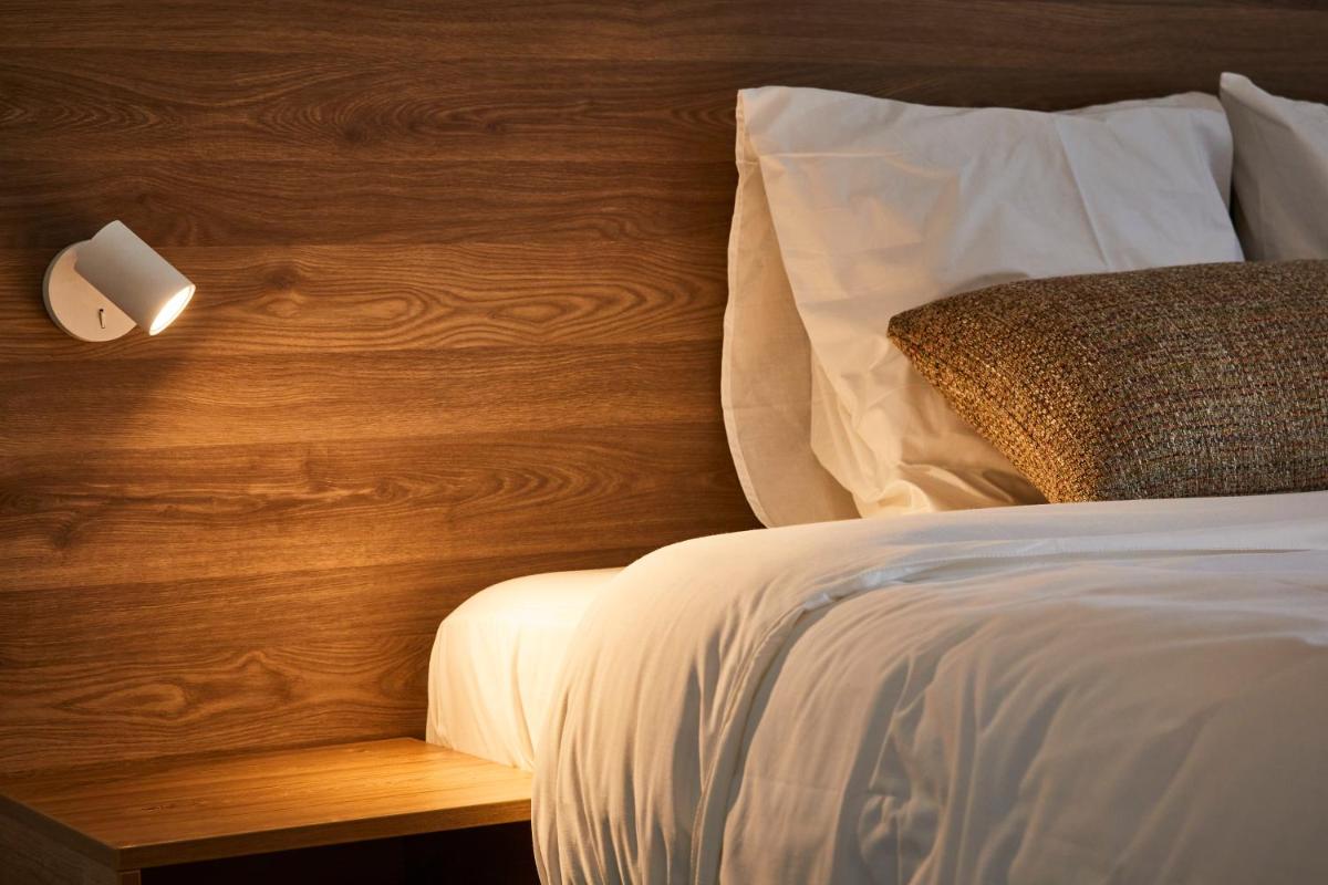 Un ou plusieurs lits dans un hébergement de l'établissement Pure Thermal Residence