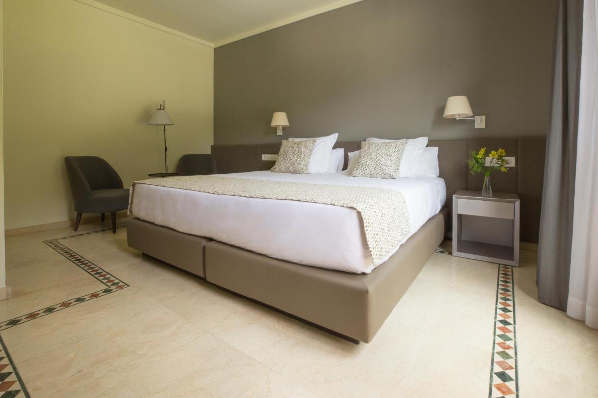 Cama o camas de una habitación en Hotel Santa Marta
