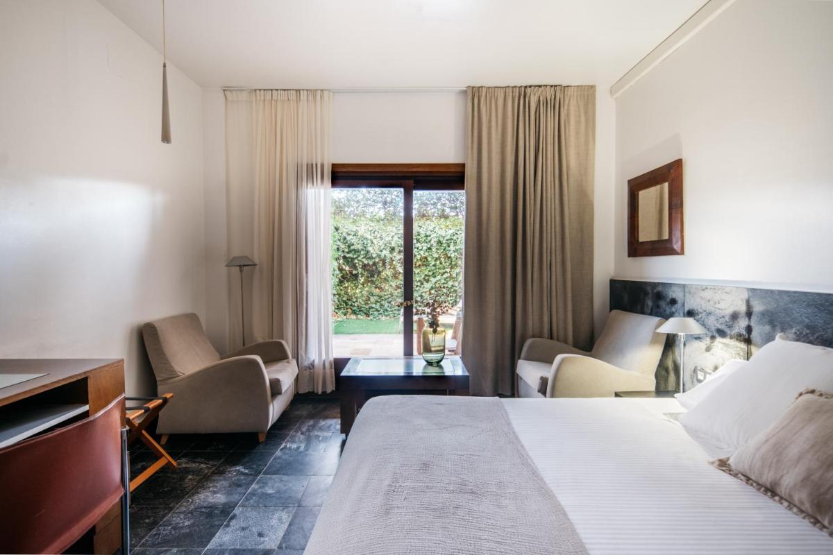 Cama o camas de una habitación en Hotel Boutique Mas Passamaner