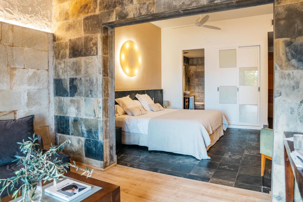 Cama o camas de una habitación en Hotel Boutique Mas Passamaner