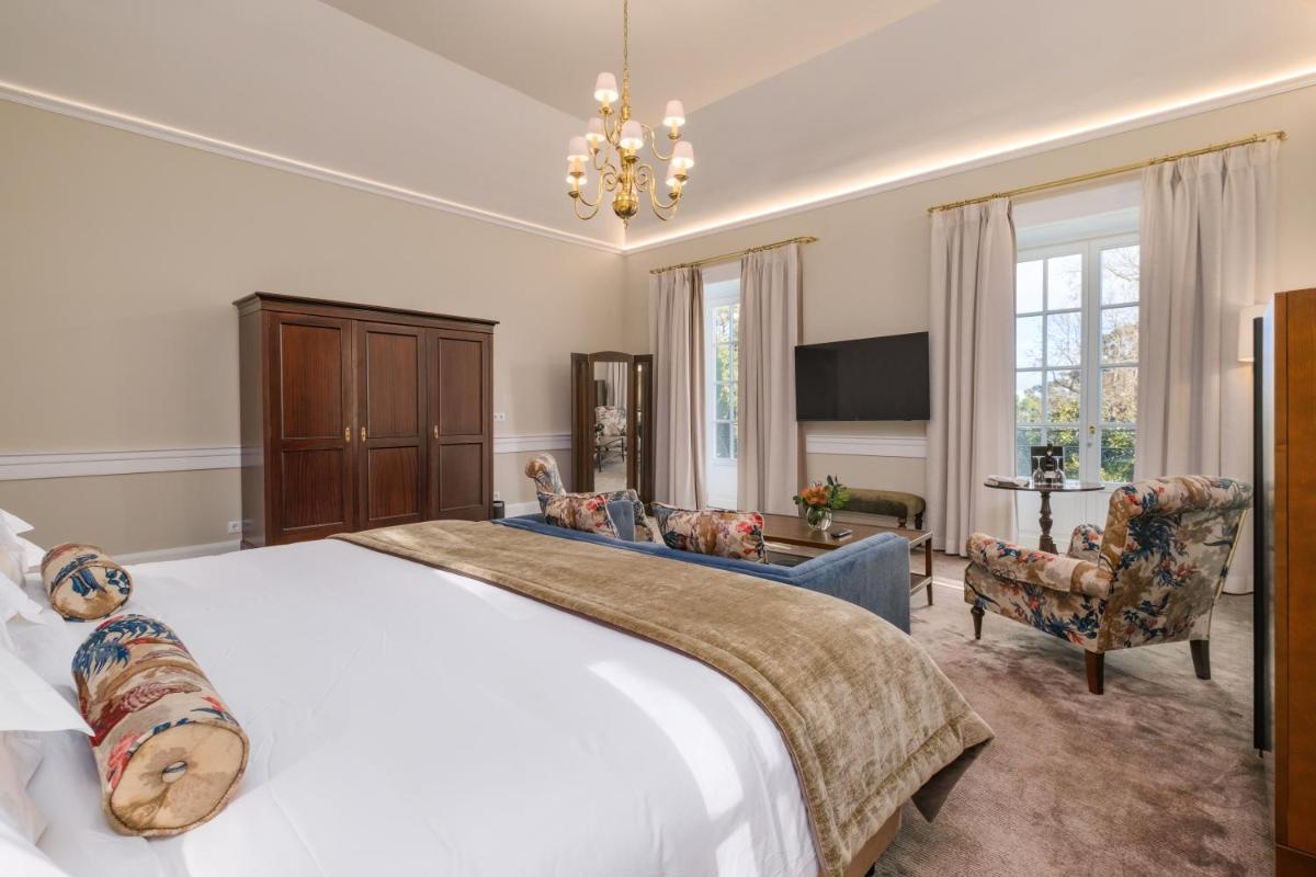 Uma cama ou camas num quarto em Casa Velha do Palheiro Relais & Chateaux