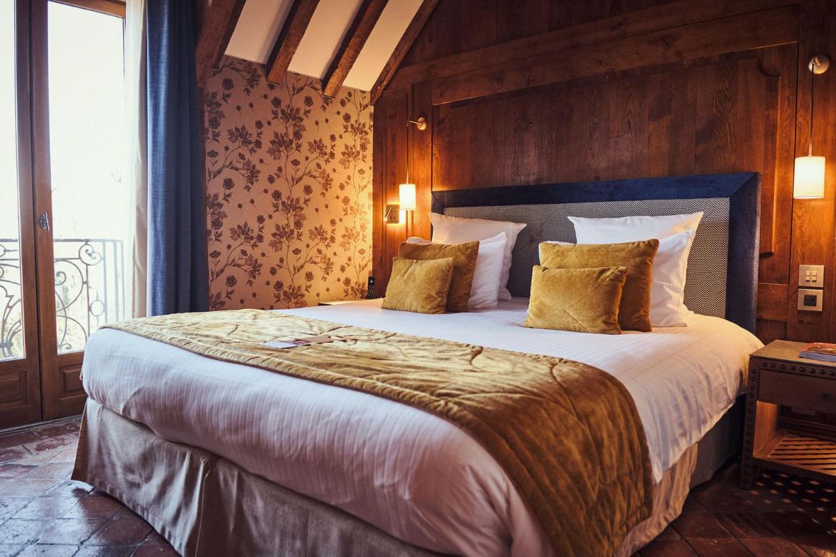 Un ou plusieurs lits dans un hébergement de l'établissement Relais Bernard Loiseau