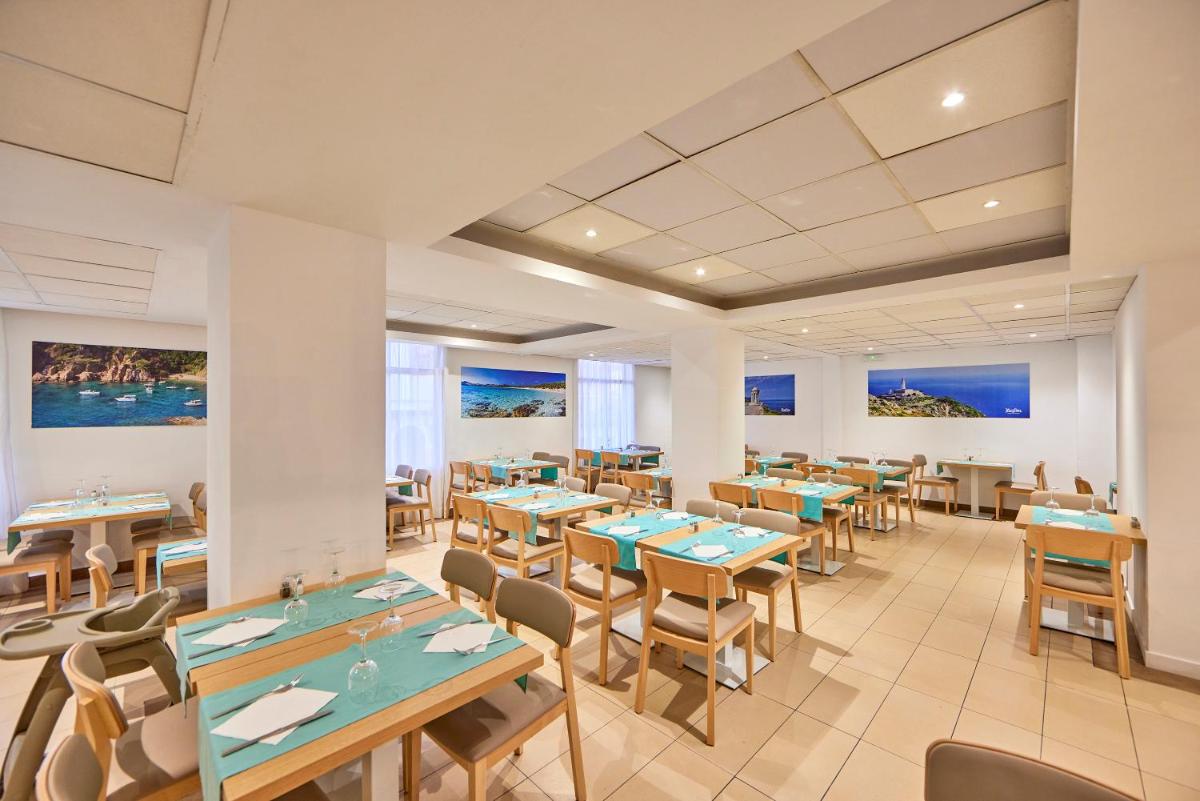 Un restaurante o sitio para comer en Hotel Ilusion Calma & Spa