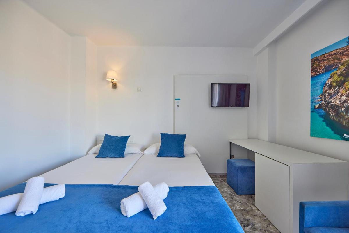 Cama o camas de una habitación en Hotel Ilusion Calma & Spa
