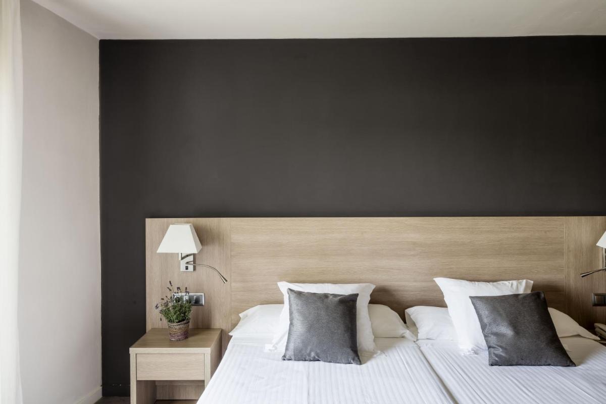 Cama o camas de una habitación en Balneari Termes Victòria