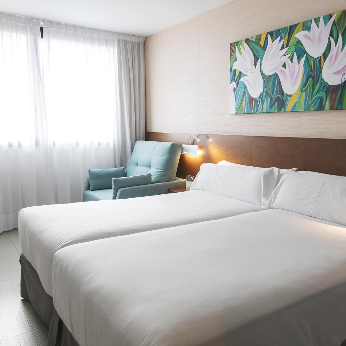 Cama o camas de una habitación en Hotel & Spa Real Ciudad De Zaragoza