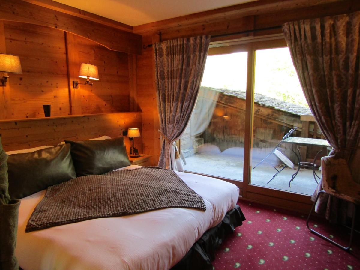 Un ou plusieurs lits dans un hébergement de l'établissement Les Grands Montets Hotel & Spa