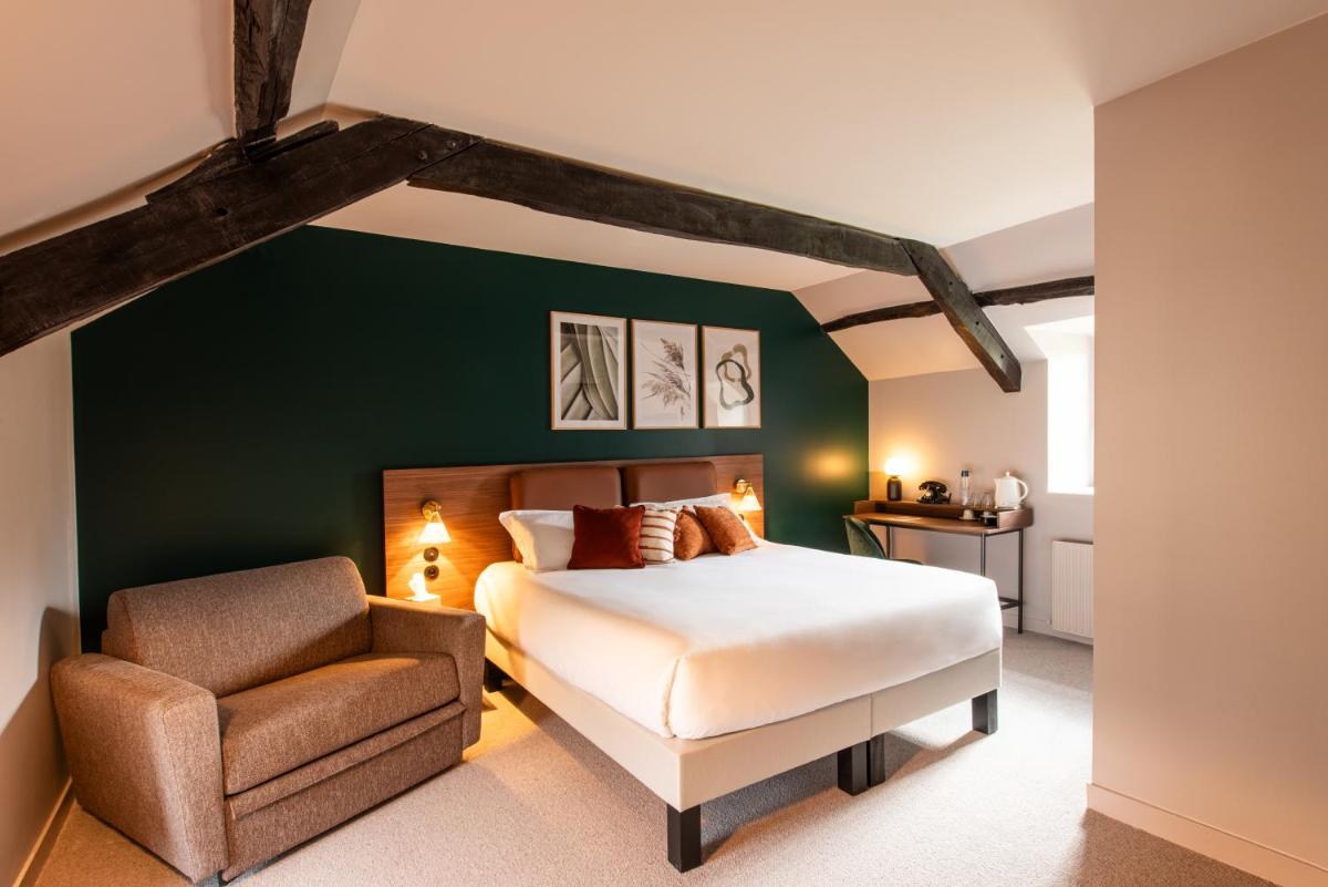 Un ou plusieurs lits dans un hébergement de l'établissement La Maison OBONO Hôtel & Spa