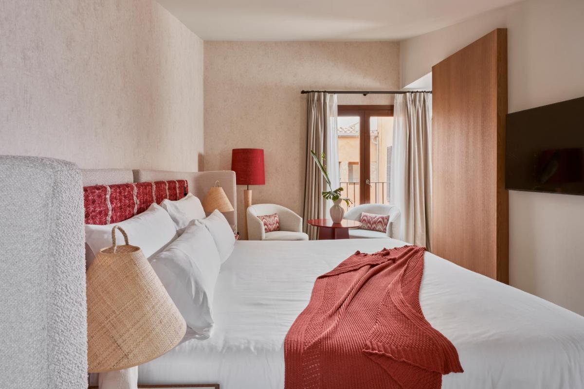 Cama o camas de una habitación en Boutique Hotel Posada Terra Santa