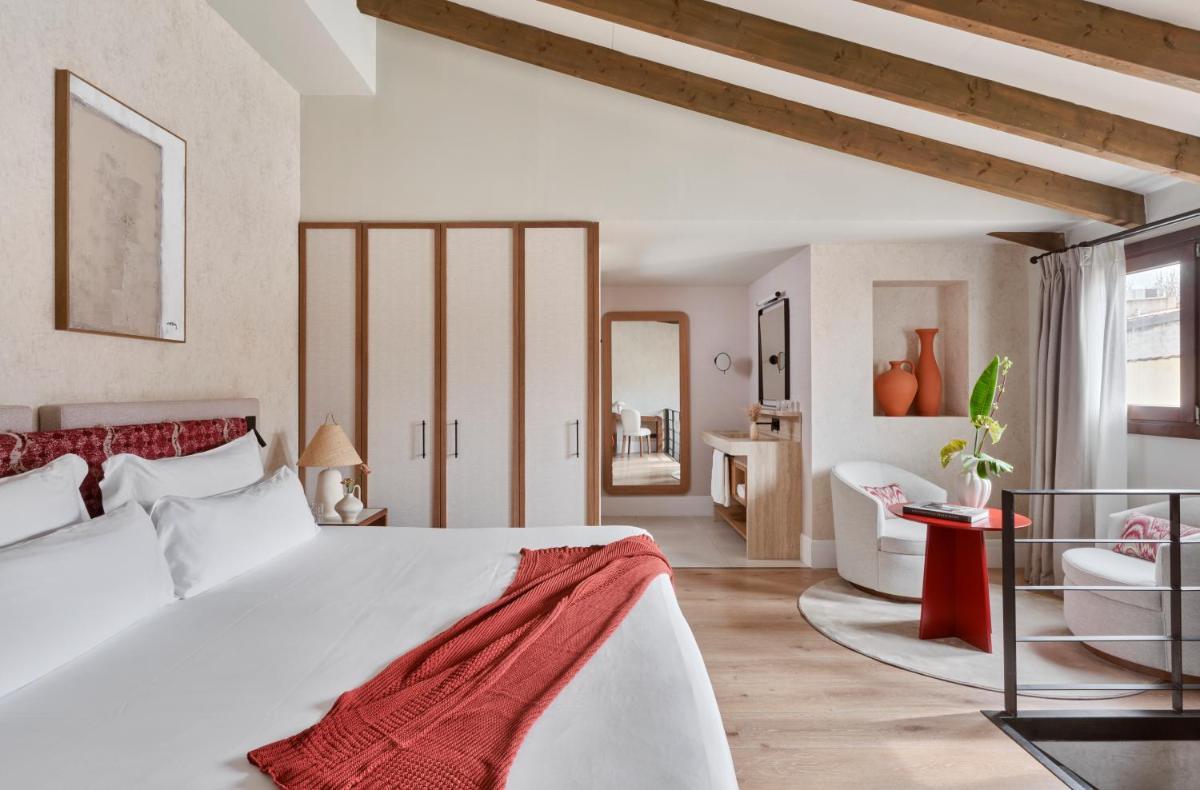 Cama o camas de una habitación en Boutique Hotel Posada Terra Santa