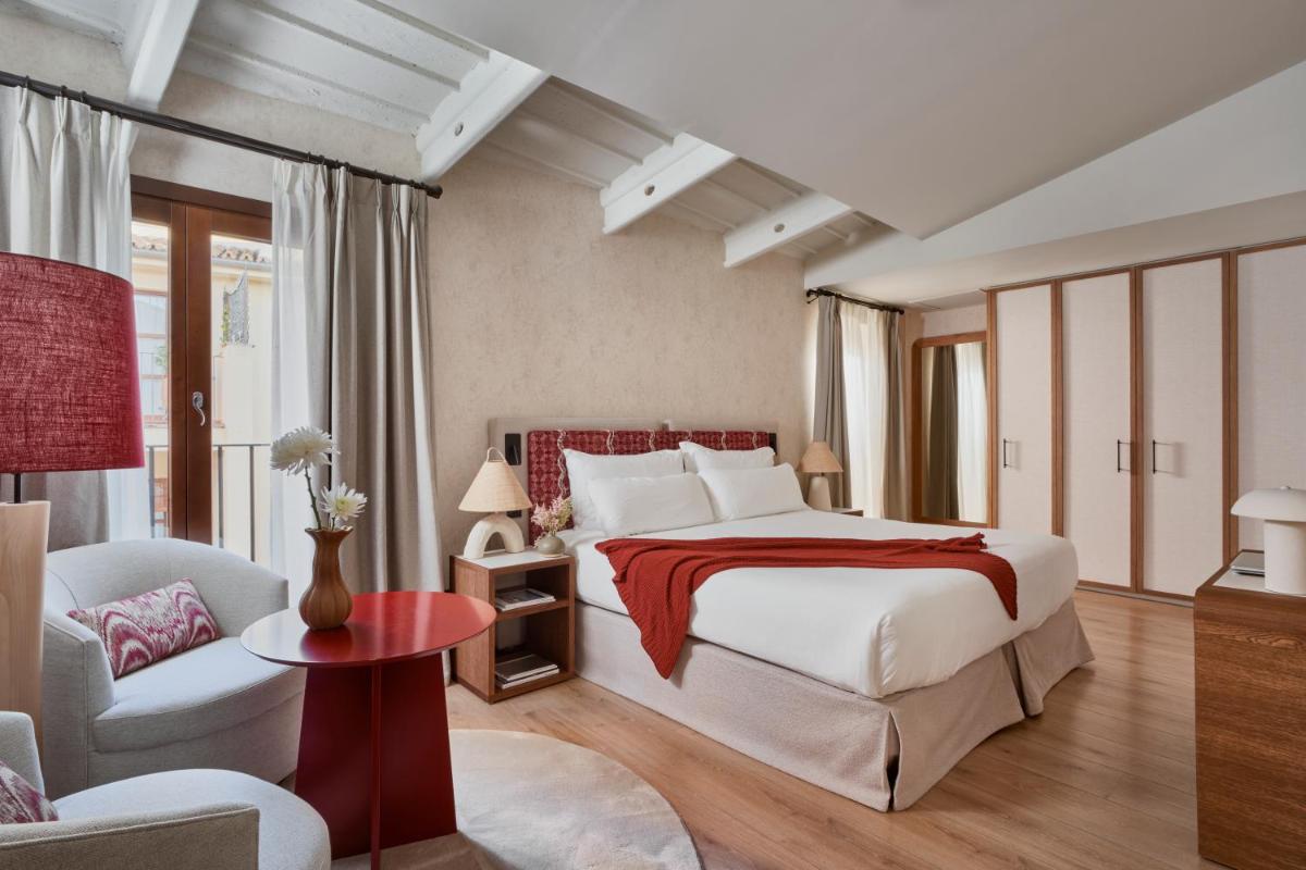 Cama o camas de una habitación en Boutique Hotel Posada Terra Santa