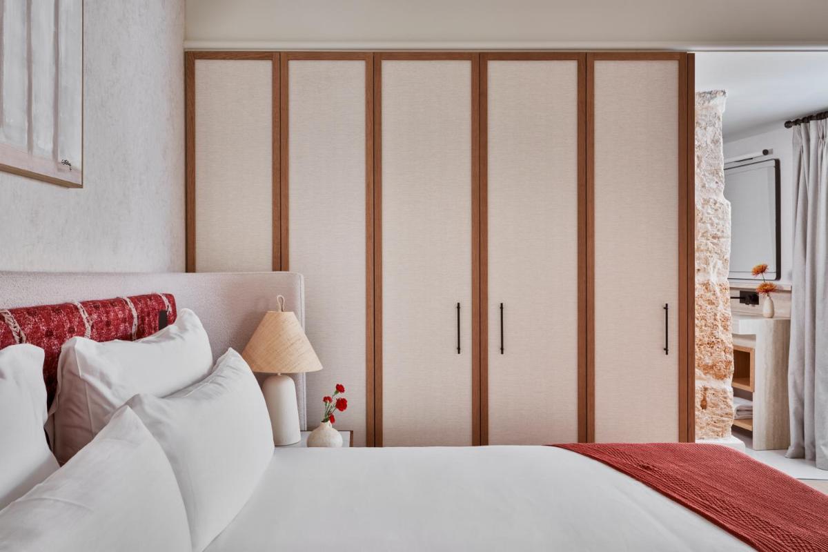 Cama o camas de una habitación en Boutique Hotel Posada Terra Santa