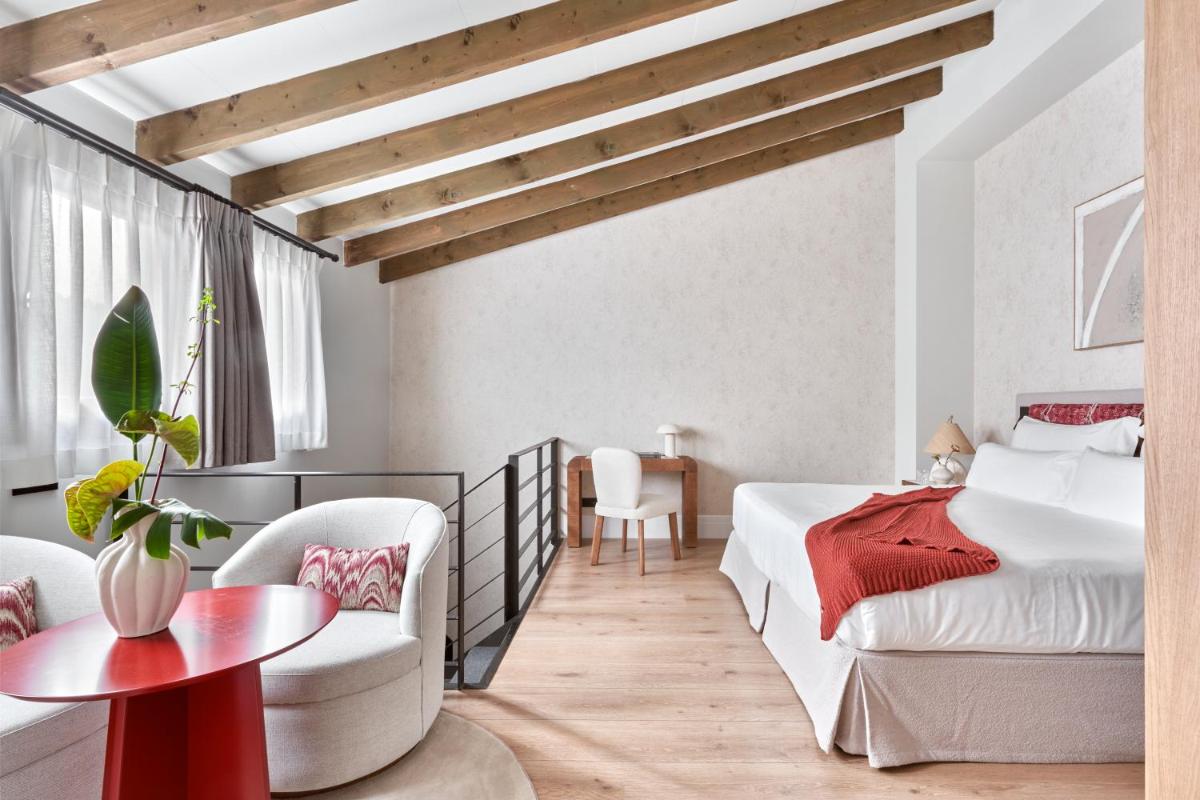 Cama o camas de una habitación en Boutique Hotel Posada Terra Santa