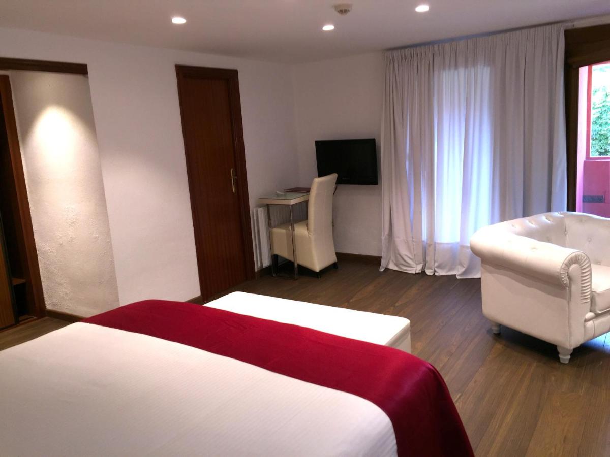 Cama o camas de una habitación en Hotel Del Lago