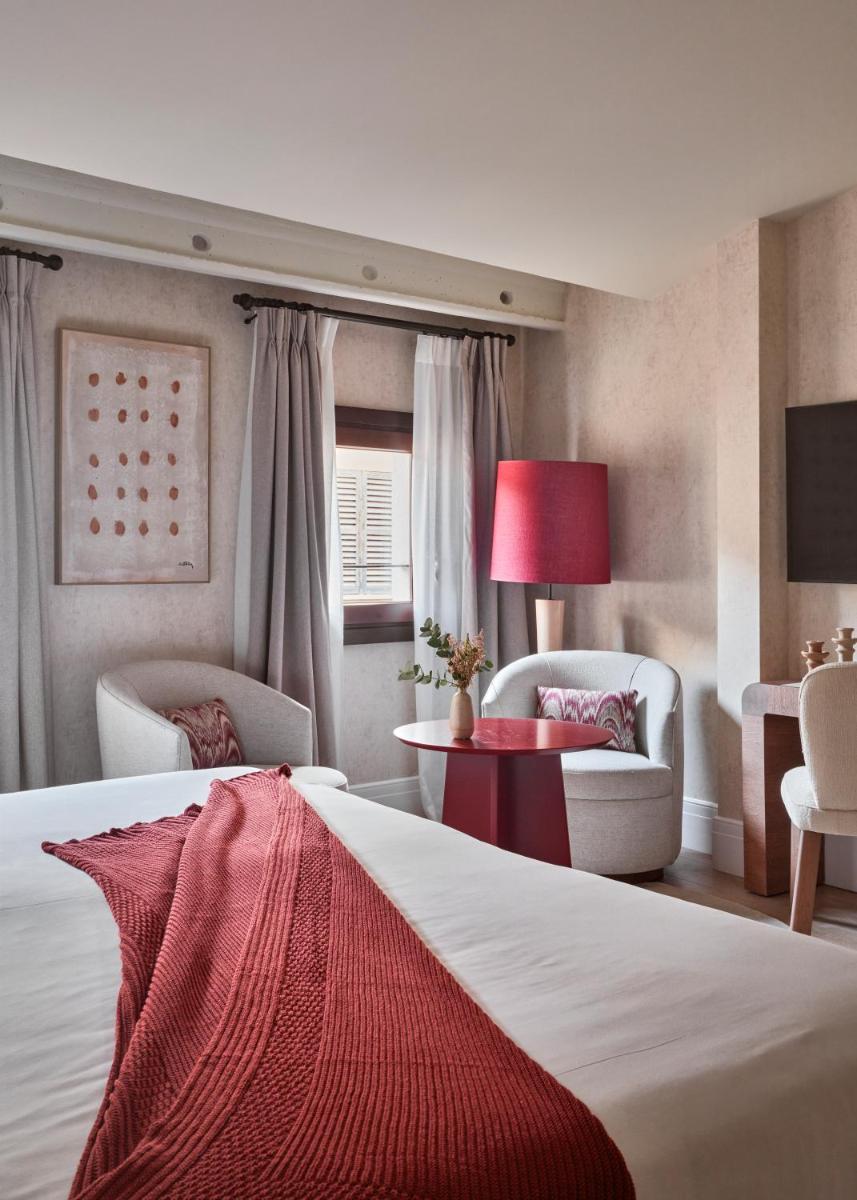 Cama o camas de una habitación en Boutique Hotel Posada Terra Santa