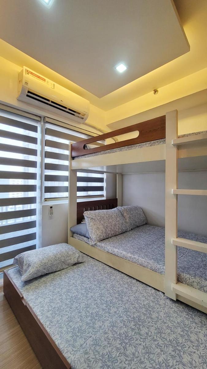 Spacious condo with pool view at Grace Residences, near BGC - Housity