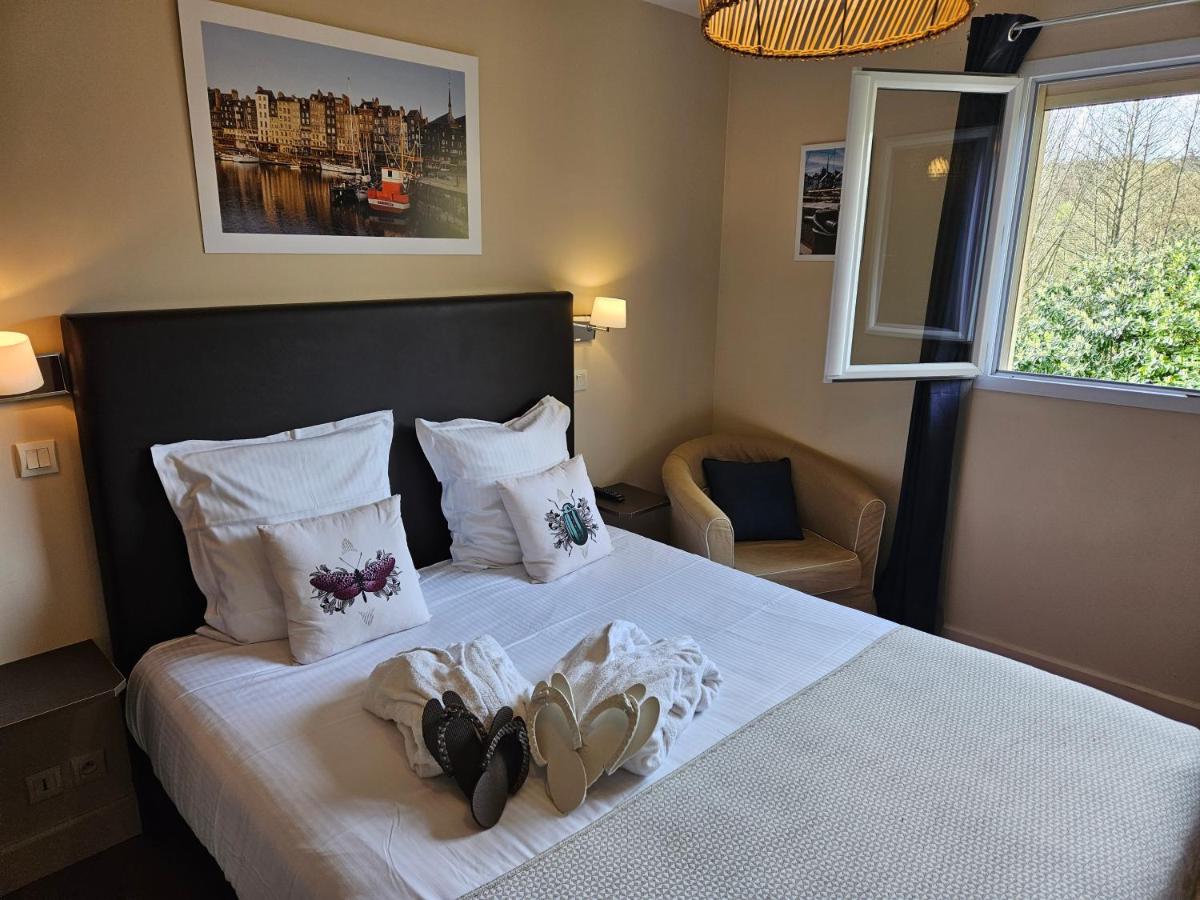 Un ou plusieurs lits dans un hébergement de l'établissement La Fraîchette-Hôtel & Spa