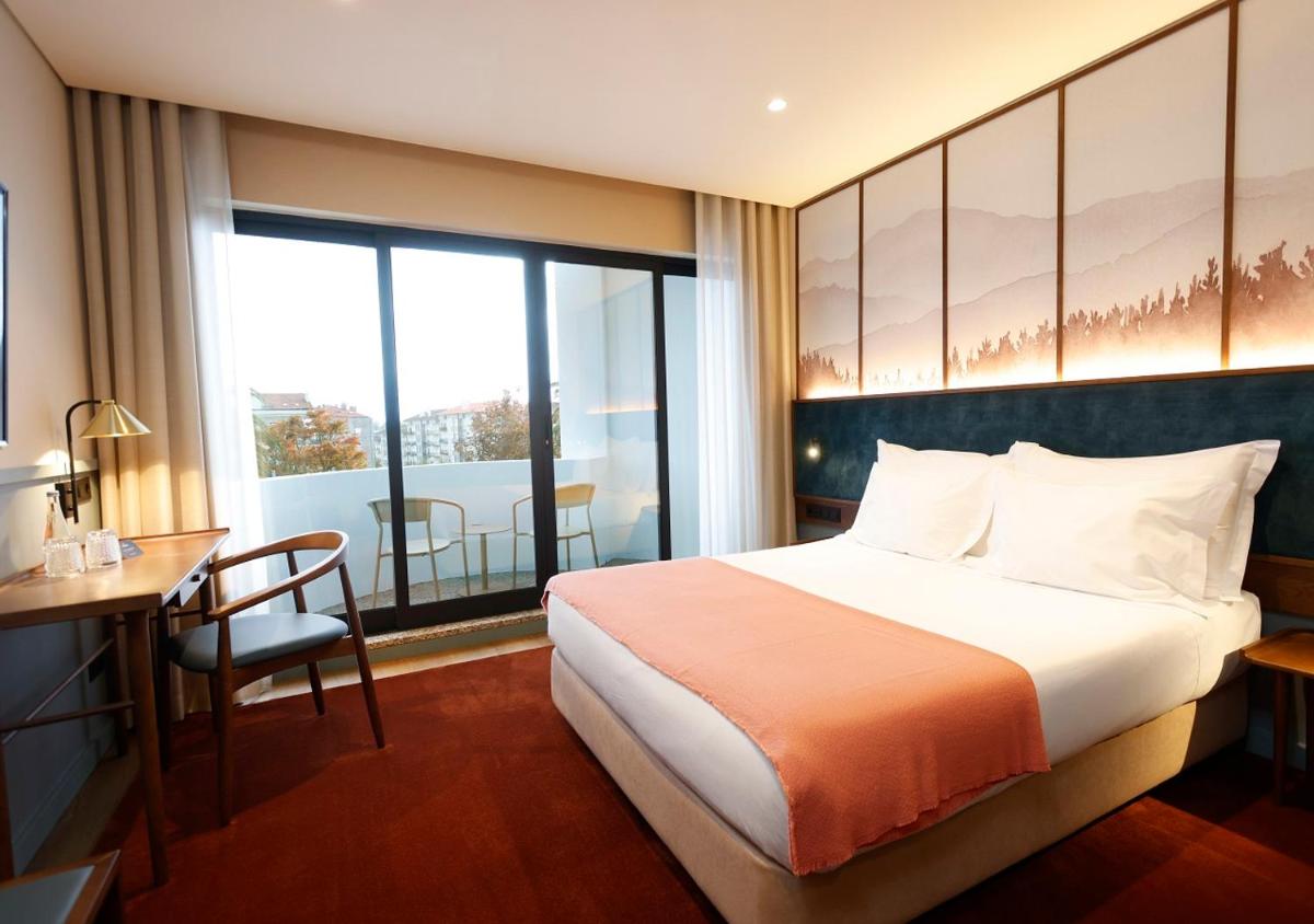 Uma cama ou camas num quarto em Montebelo Viseu Congress Hotel & Spa