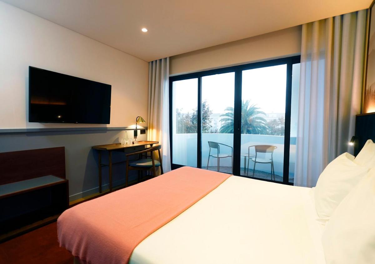 Uma cama ou camas num quarto em Montebelo Viseu Congress Hotel & Spa